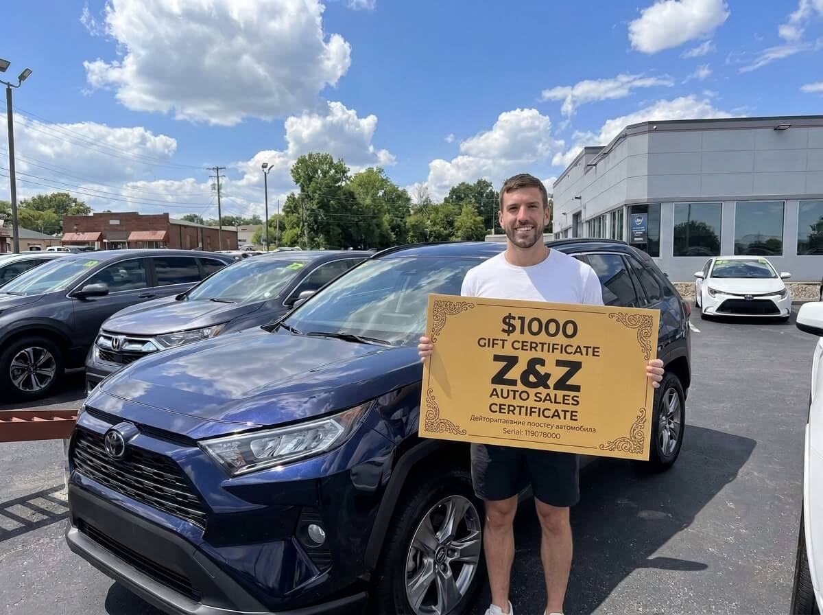 David Chen with his new car at ZZ Auto Sales